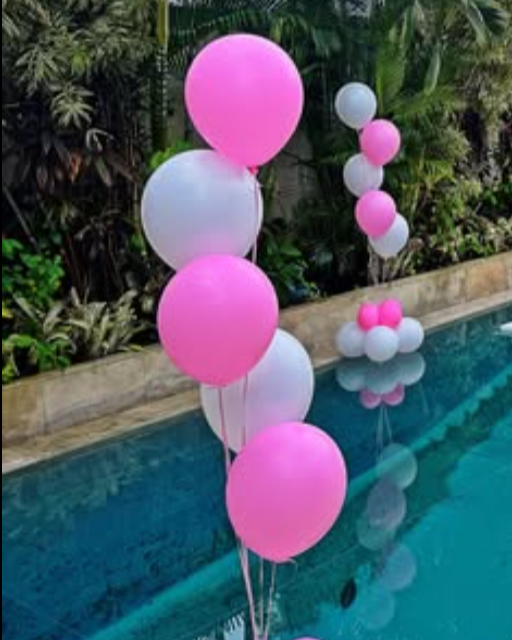 floating balloon on the pool in pink and white